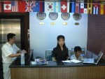Once I had made it to my hotel the Beijing Dream Castle the task of translating for me fell on them.  Here they are writing down for me in Chinese the address of the triathlon venue.