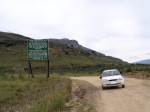 This sign states that it is illegal to drive up the road to the Sani Pass without a 4WD vehicle.