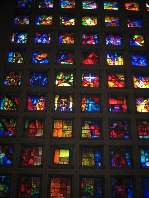 The stained glass windows were beautiful from inside the dark church.