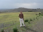 Beautiful Maya stands in front of a beautiful view of the Ethiopian countryside.