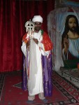 The Ethiopian Orthodox Church is one of the oldest branches of Christianity, and Lalibela is their holiest site.  Here, a priest poses for us within one of their churches.