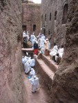 The town of Lalibela is built around 13 churches that were carved straight down through solid rock.  Ground level is up above on the top of the far ledge, these passageways and churches were carved out by hand.