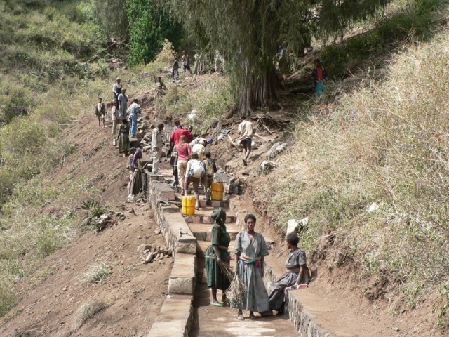 The local women were building the steps up to the church as we were walking up them.