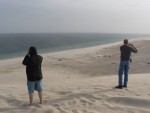 Mom and dad take in the view of the Arabian Sea from atop a sand dune.