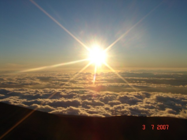 Haleakala is 10,023 feet above sea level, and it was cold at the top! We huddled here to watch the sunset.