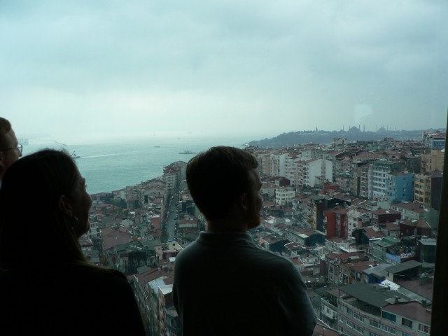 Ryan, Maya and Mike take in the view from our hotel room.  That is the Haghia Sophia church and the Blue Mosque on the horizon.