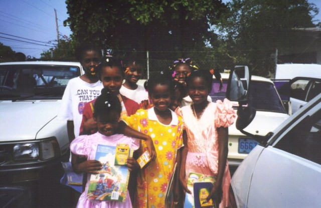 Some of the Jamaican girls proudly show off their new toys.