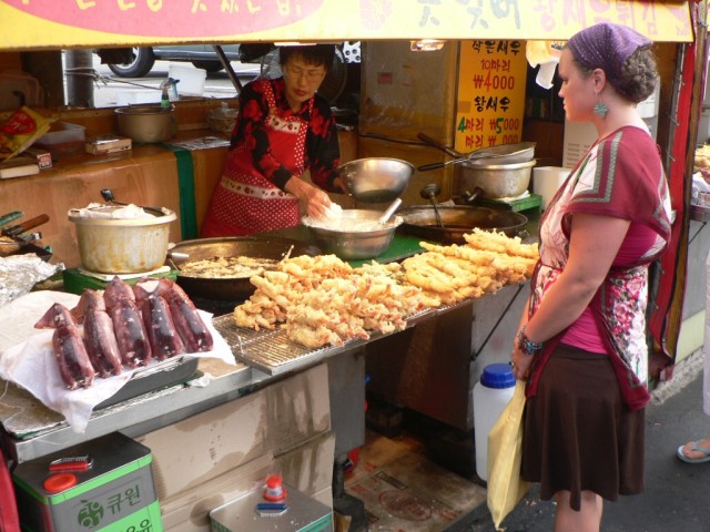 The delicious little appetizer in the bottom left of the pic is squid wrapped around pork and veggies, which they chopped up and friend for us.  mmmMMMmmm...