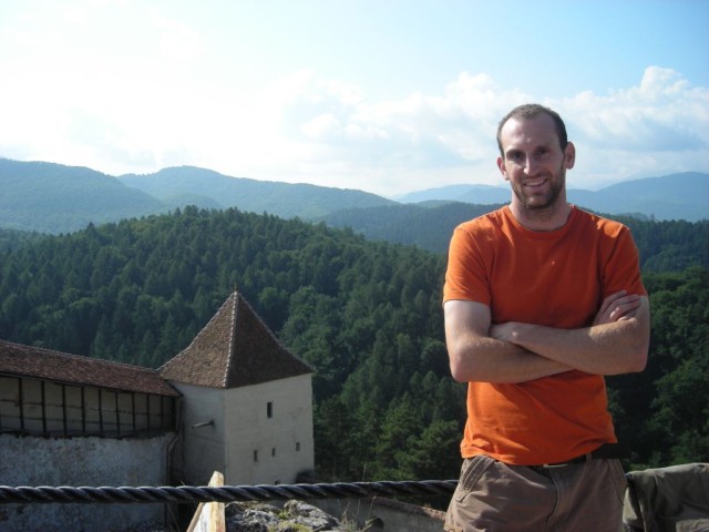 The Romanian countryside was beautiful woods and farmland on rolling hills.