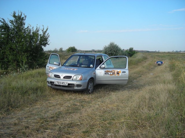 Our plan was to try to make it into Moldova and enter Ukraine from there, but it was not to be.  We tried twice at two different borders and were sent back both times.  Since we were running out of options, we decided to try our luck going south around the Black SeaHere I am making sure not to neglect my exercises even though we happen to be sleeping in a farmers field. :-)