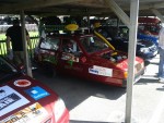 Two mechanically inclined young men decided to make the rally as hard as they reasonably could on themselves by removing the front axle and both wheels, and replacing it with a modified axle and single wheel in the center.