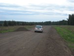 The unofficially named Trans-Siberian highway runs parallel to the Trans-Siberian railway, but in many places it was in terrible condition. This section was unpaved with random giant piles of dirt here and there.