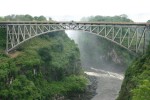 This is the Victoria Falls Bridge.  The tiny blue roof that you see in the middle of the bridge covers the platform from which we were to make our jump.